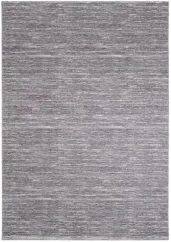 Prskaný tmavo šedý koberec vhodný do jedálne či spálne.