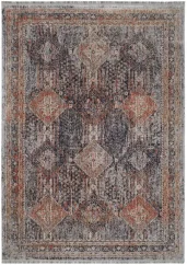 Štýlový koberec s tradičným motívom, ktorý je plný tlmených farieb.