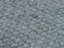Šedo modrý koberec vytvárajú guličky, ktoré vznikajú metódou tkania.